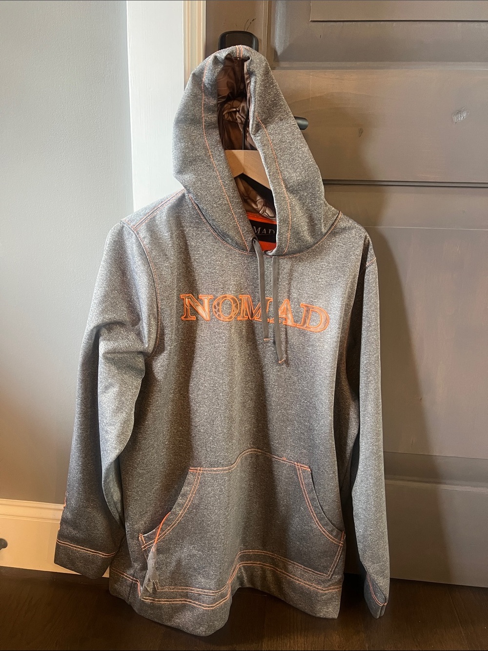 Nomad Gray Hoodie with Orange Logo and Stitching
